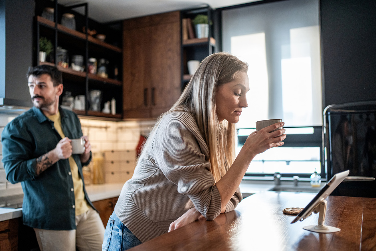 Miserable couple drinking coffee